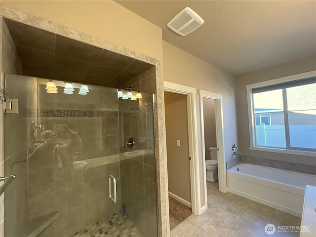 bathroom featuring tile patterned flooring, lofted ceiling, independent shower and bath, and toilet