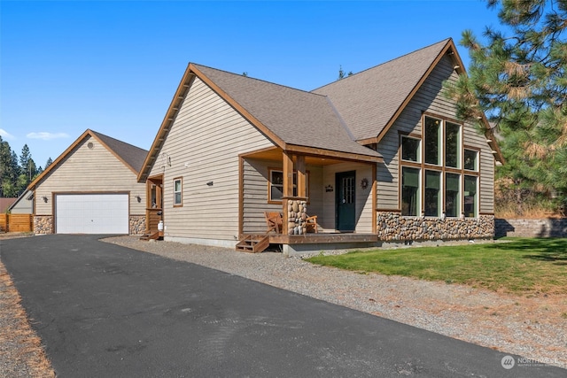 view of front of property featuring a garage and covered porch