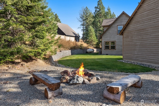 view of yard with a fire pit