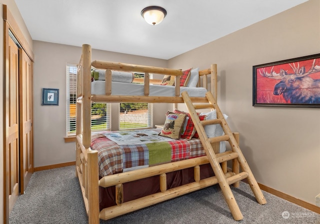 bedroom with carpet and a closet