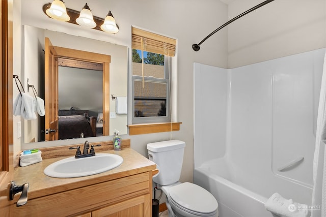 full bathroom with washtub / shower combination, oversized vanity, and toilet