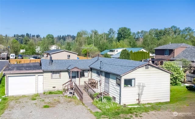 single story home featuring a garage