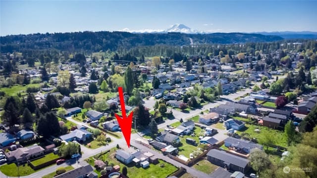 drone / aerial view featuring a mountain view