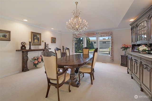 carpeted dining space featuring an inviting chandelier and crown molding