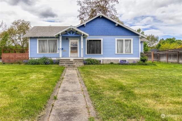 bungalow-style home featuring a front yard