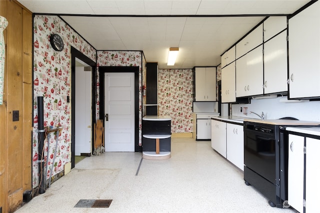 kitchen with sink, white cabinets, and range with electric cooktop