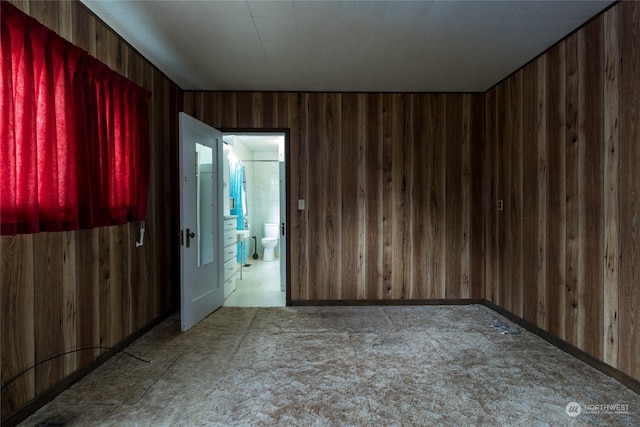 empty room with wooden walls