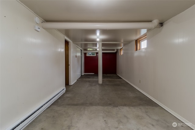 garage featuring a baseboard heating unit