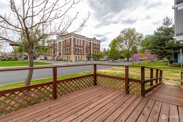 wooden deck with a yard