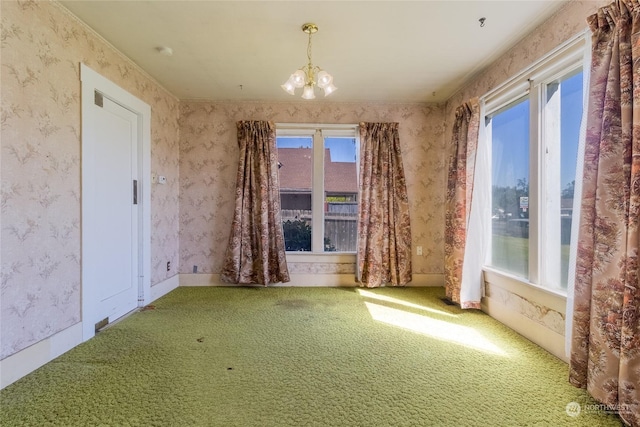 644 S Main St, Milton-Freewater, OR 97862 - spare room with a notable chandelier, a wealth of natural light, and carpet