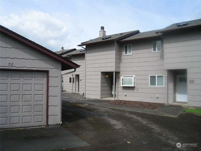 view of property exterior featuring a garage