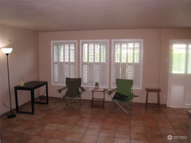 living area featuring tile flooring