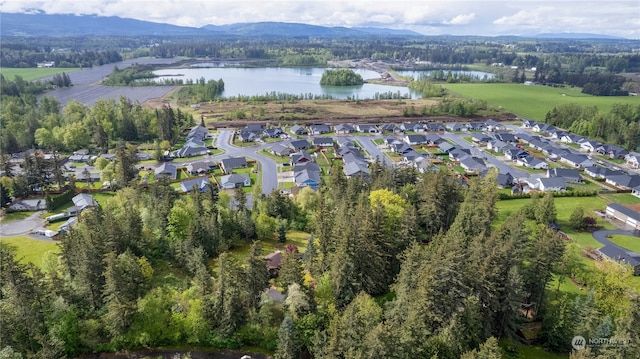 bird's eye view with a water and mountain view