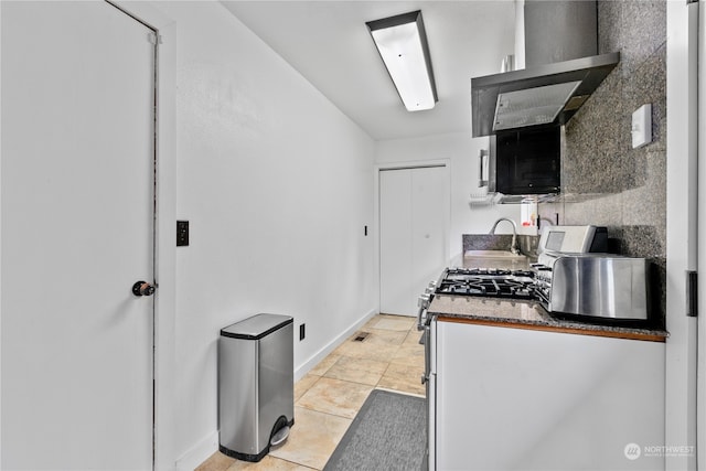 kitchen with sink and light tile floors