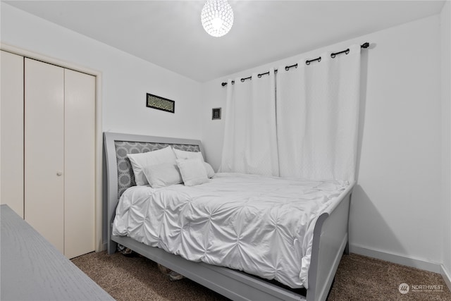 bedroom with carpet and a closet