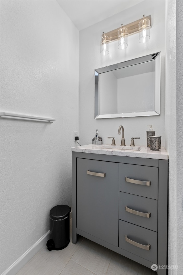 bathroom with vanity and tile floors