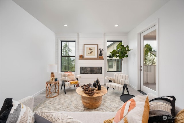 sitting room with a large fireplace