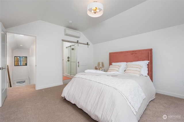 bedroom with a wall mounted air conditioner, lofted ceiling, carpet flooring, and a barn door