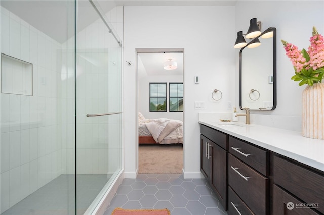 bathroom featuring vanity, tile patterned flooring, and an enclosed shower