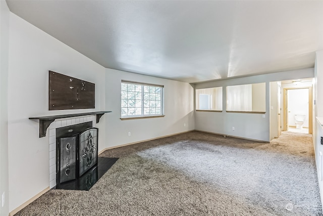 unfurnished living room with carpet floors