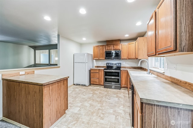 kitchen featuring dishwashing machine, double oven range, sink, white refrigerator, and light tile floors