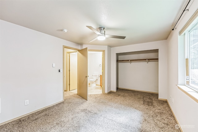 unfurnished bedroom featuring carpet flooring, a closet, ceiling fan, and multiple windows