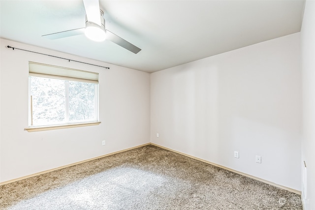 empty room featuring ceiling fan and carpet floors