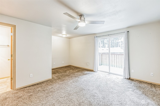 carpeted empty room with ceiling fan