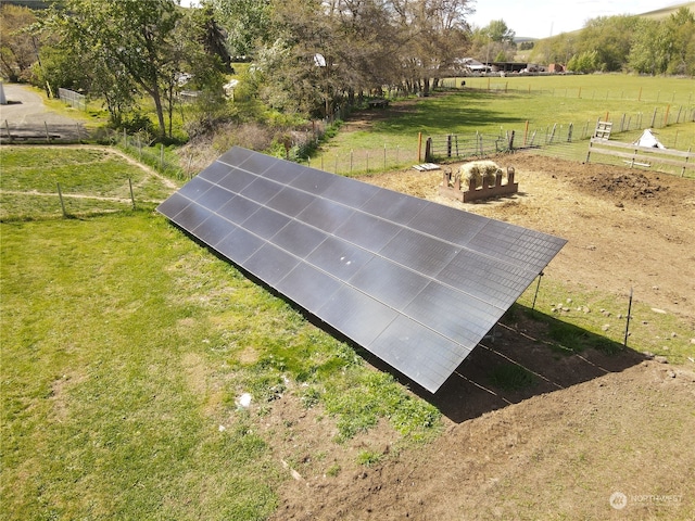 view of storm shelter featuring a yard and a rural view