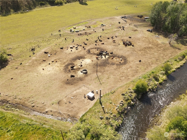 aerial view featuring a rural view and a water view