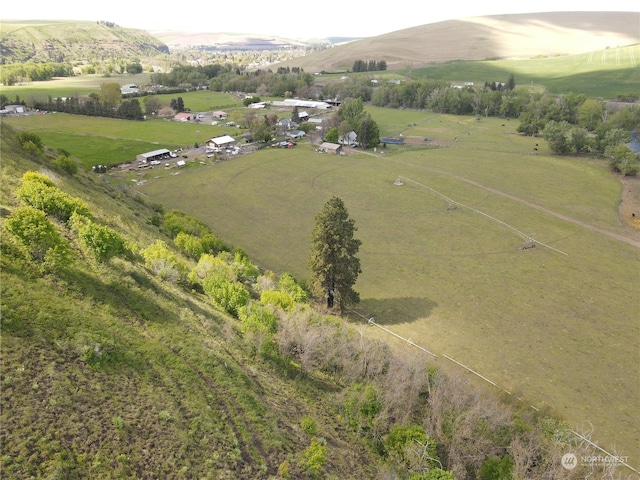 drone / aerial view featuring a mountain view and a rural view