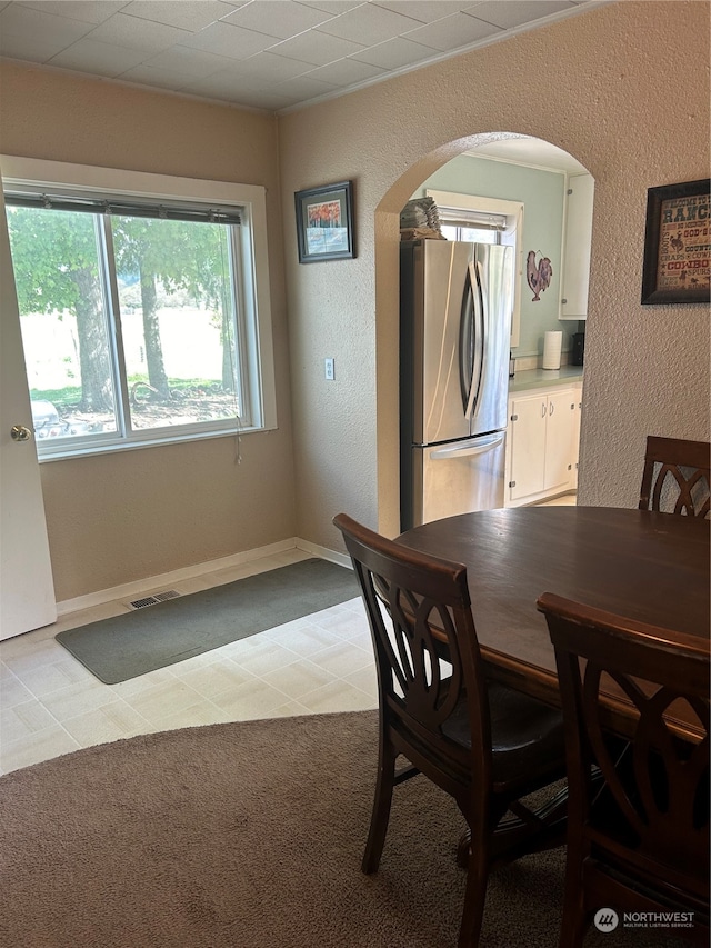 dining space with light carpet