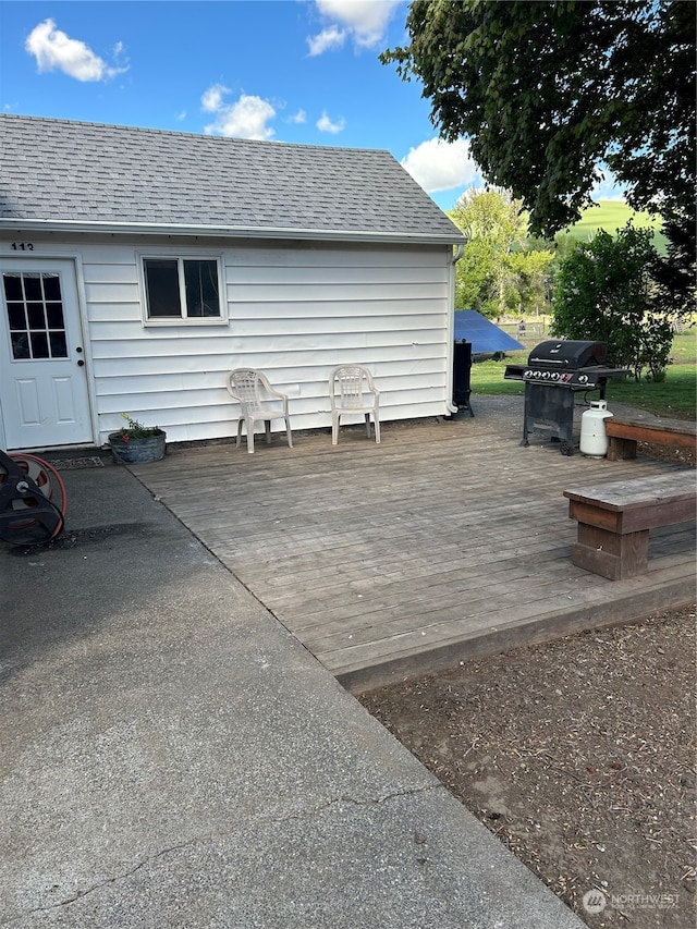 view of terrace with area for grilling and a deck