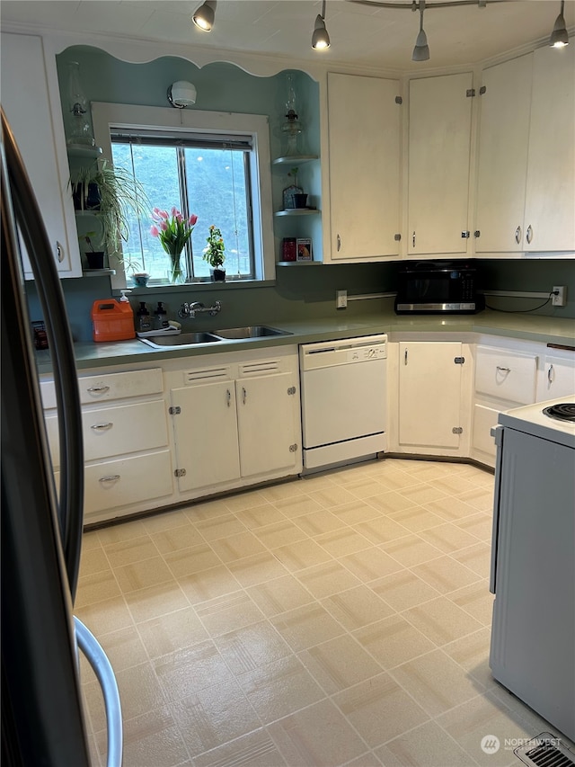 kitchen featuring stove, fridge, light tile flooring, white cabinetry, and white dishwasher