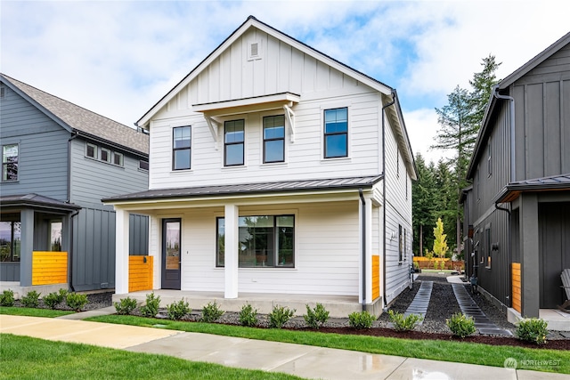 modern farmhouse featuring covered porch