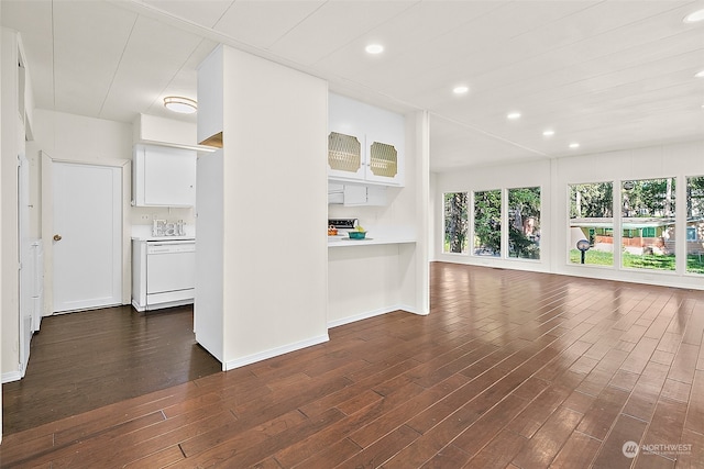 unfurnished living room with dark wood-type flooring