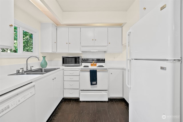 kitchen featuring exhaust hood, white cabinets, sink, white appliances, and dark hardwood / wood-style floors