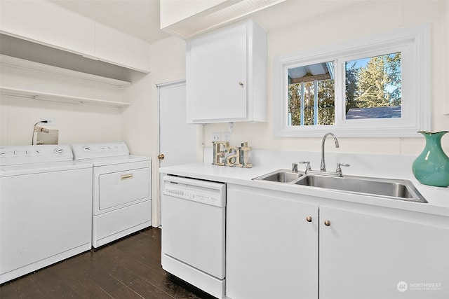 washroom featuring sink, dark hardwood / wood-style flooring, and washer and dryer