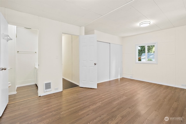 empty room featuring hardwood / wood-style floors