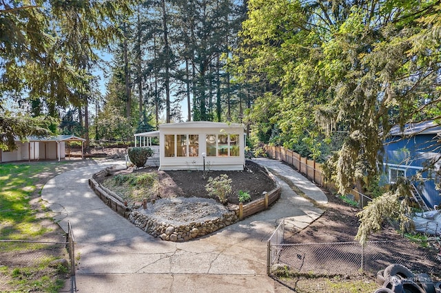 view of front of property with a sunroom