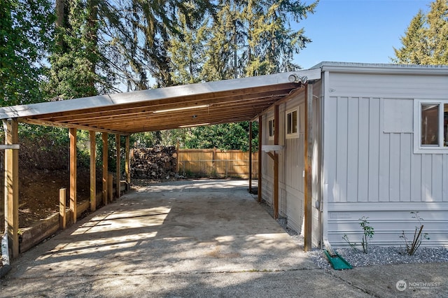 view of vehicle parking featuring a carport