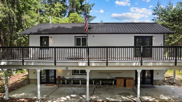 back of house with french doors and a patio