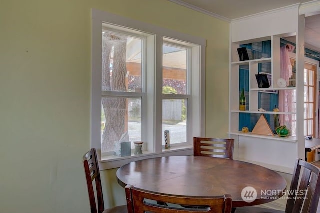 dining space featuring ornamental molding