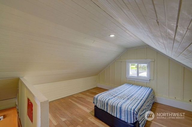 interior space featuring wooden ceiling, light wood-type flooring, and vaulted ceiling