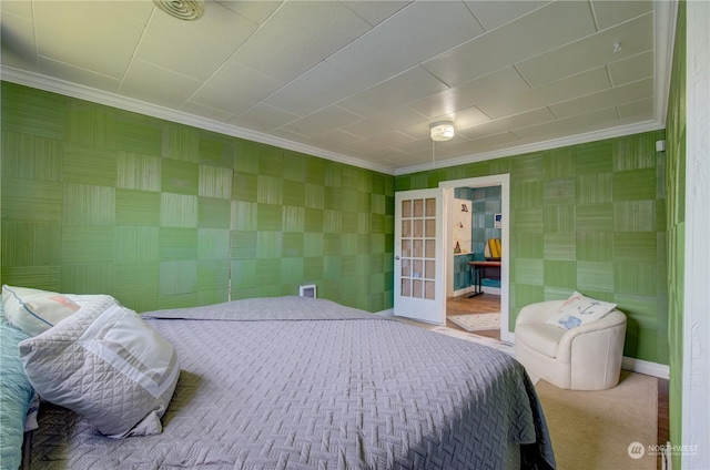 bedroom with carpet flooring and crown molding