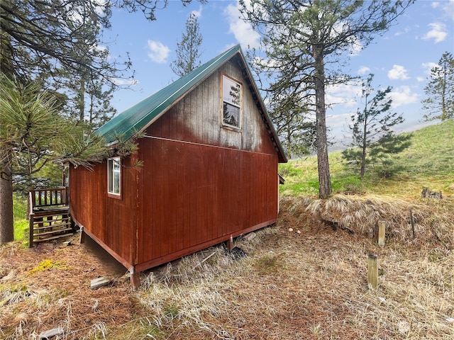 view of side of home with an outdoor structure