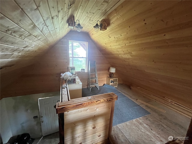 bonus room with wooden walls, vaulted ceiling, and wooden ceiling