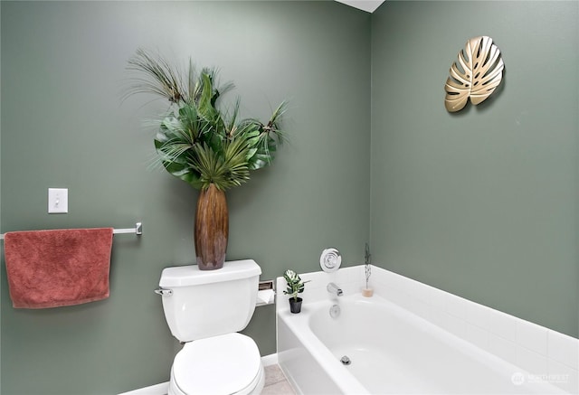 bathroom with tile patterned floors, toilet, and a bath