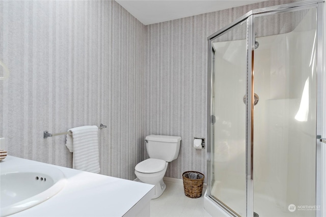 bathroom with vanity, toilet, and an enclosed shower