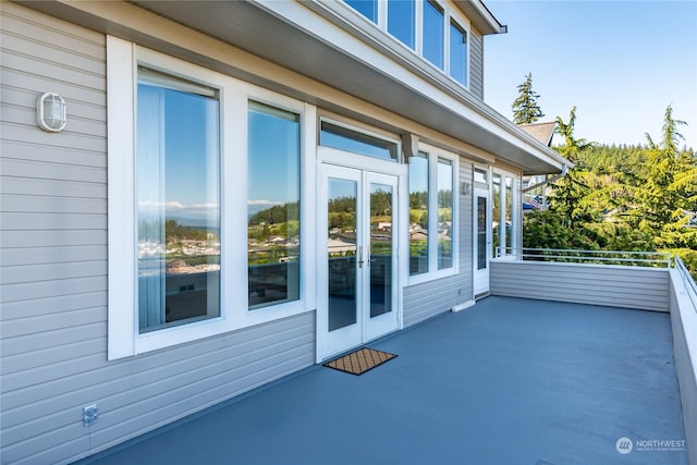 view of patio / terrace featuring french doors and a balcony